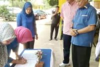 Raja Ariza dan Juramadi Esram saat memantau pendaftaran Family Gathering Disdagin Tpi (Foto: Istimewa)